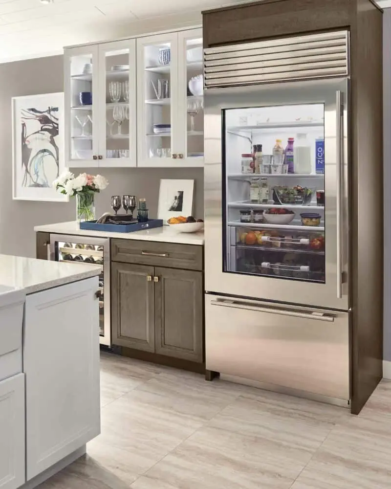 Glass-door built-in refrigerator in a custom kitchen
